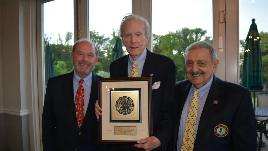 John Rochford (center), champion of the Caddie Scholarship Foundation, passes away